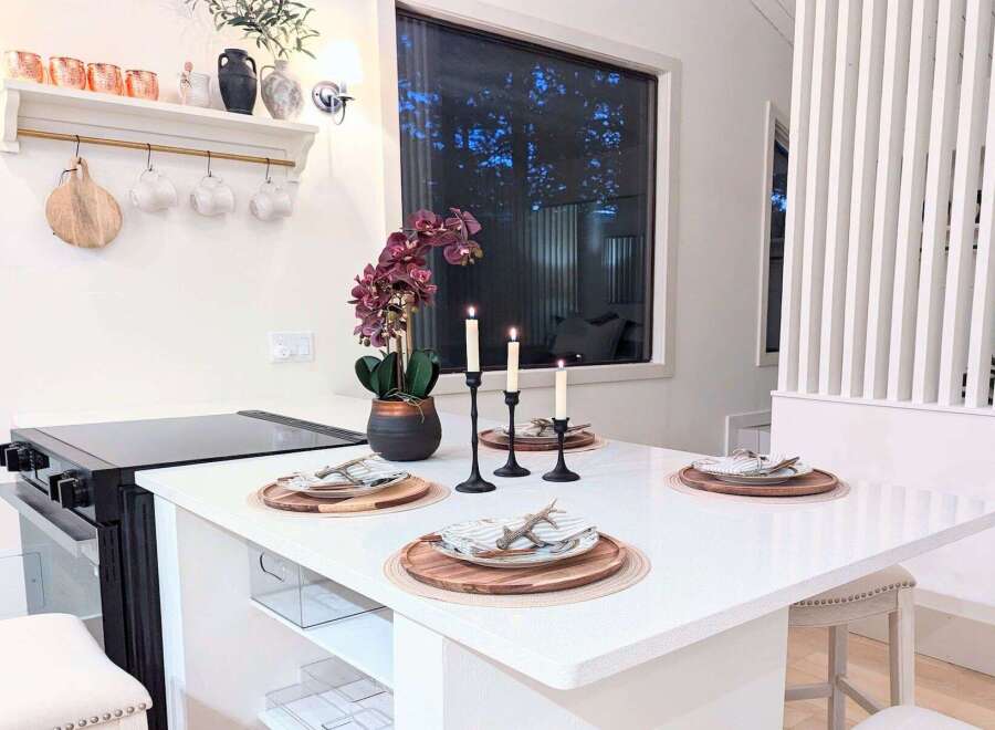 Experience modern living in this stylish kitchen island, perfect for intimate dining or casual entertaining.