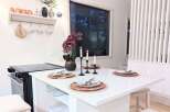 Experience modern living in this stylish kitchen island, perfect for intimate dining or casual entertaining.