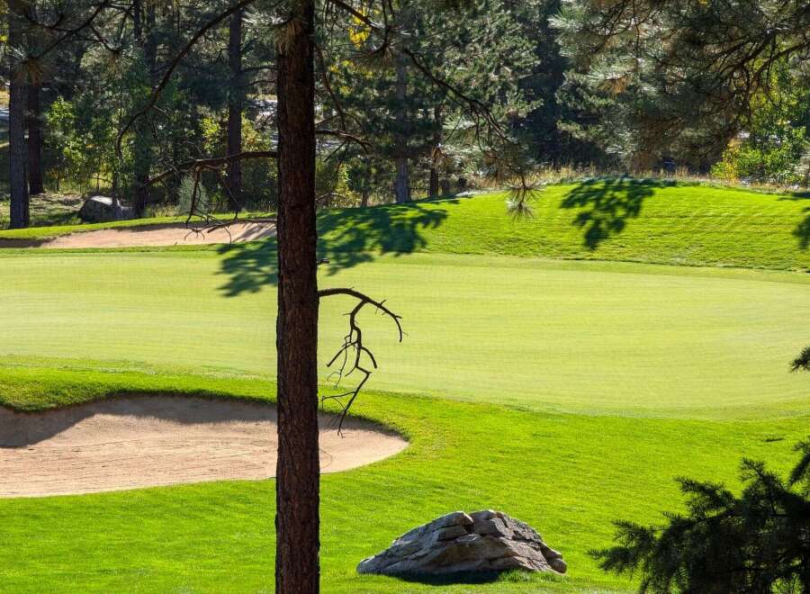 Experience the beauty of this meticulously maintained golf course, featuring lush green fairways and strategically placed sand traps.