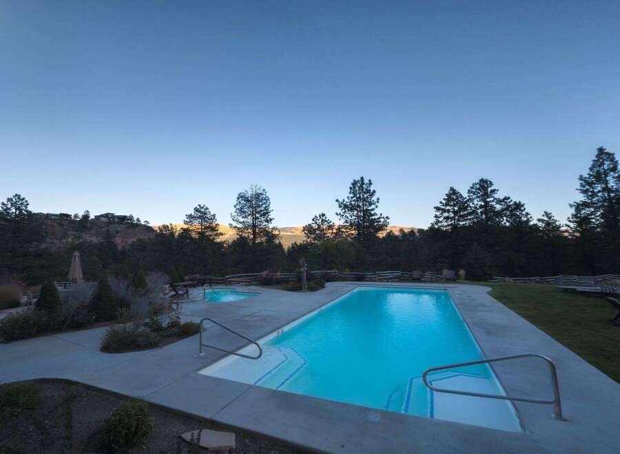 Experience luxury living with this stunning property featuring a pristine swimming pool and a relaxing hot tub, perfect for unwinding.