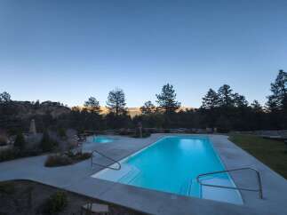 Experience luxury living with this stunning property featuring a pristine swimming pool and a relaxing hot tub, perfect for unwinding.