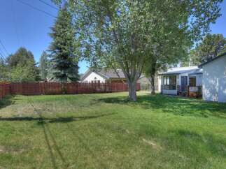 Enjoy the spacious backyard of this charming property, perfect for outdoor activities and relaxation.