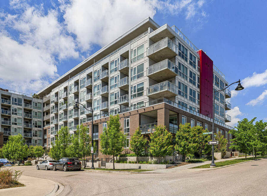 Discover modern urban living in this stunning condo building featuring sleek architecture and private balconies.