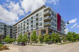 Discover modern urban living in this stunning condo building featuring sleek architecture and private balconies.