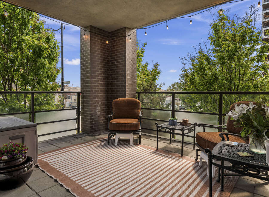 Enjoy your morning coffee or evening drinks on this spacious balcony, perfect for outdoor living.