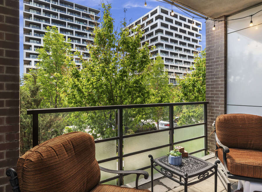 Enjoy your morning coffee or evening relaxation on this charming balcony, complete with comfortable seating and a small table.