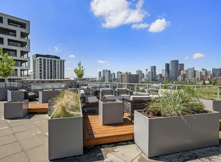 Experience urban living at its finest with this stunning rooftop patio, offering breathtaking panoramic views of the city skyline.