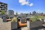 Experience urban living at its finest with this stunning rooftop patio, offering breathtaking panoramic views of the city skyline.