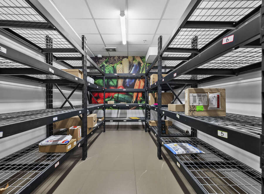 Discover efficient storage solutions with this well-organized shelving unit, perfect for maximizing space in commercial or residential settings.