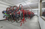 Secure your active lifestyle with this dedicated bike storage facility, featuring a multi-level rack system designed to maximize space and protect your bicycles.