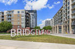 Discover modern living in this vibrant urban community, featuring stylish apartment buildings with balconies and large windows.
