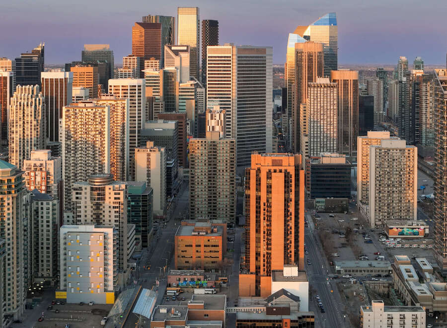 Experience urban living at its finest in this vibrant cityscape, bathed in the warm glow of sunset.