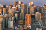 Experience urban living at its finest in this vibrant cityscape, bathed in the warm glow of sunset.