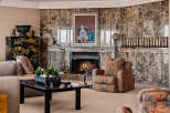 Experience luxury living in this elegant living room, featuring a stunning marble fireplace as the centerpiece.
