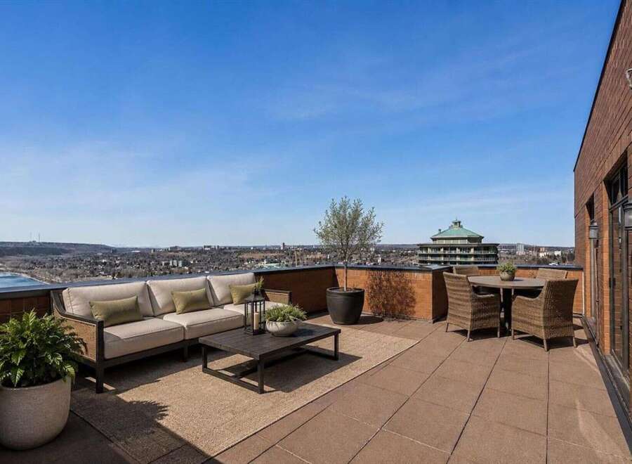 Experience breathtaking panoramic views from this expansive rooftop terrace, perfect for entertaining or serene relaxation.