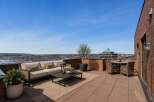 Experience breathtaking panoramic views from this expansive rooftop terrace, perfect for entertaining or serene relaxation.