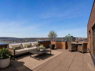 Experience breathtaking panoramic views from this expansive rooftop terrace, perfect for entertaining or serene relaxation.