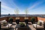 Experience breathtaking panoramic city views from this stunning rooftop patio, perfect for entertaining or relaxing.