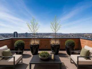 Experience breathtaking panoramic city views from this stunning rooftop patio, perfect for entertaining or relaxing.