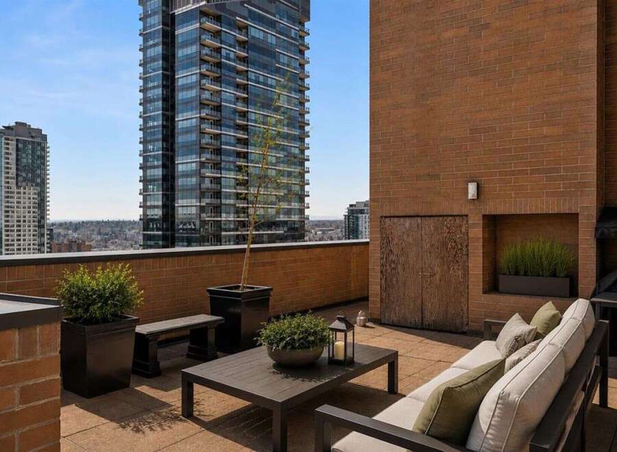 Enjoy breathtaking city views from this expansive rooftop terrace, perfect for entertaining or relaxing.