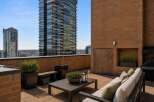 Enjoy breathtaking city views from this expansive rooftop terrace, perfect for entertaining or relaxing.