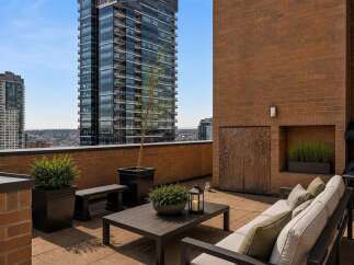 Enjoy breathtaking city views from this expansive rooftop terrace, perfect for entertaining or relaxing.