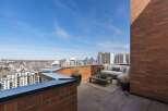Experience breathtaking city views from this expansive rooftop terrace, perfect for entertaining or relaxing.