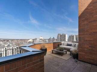 Experience breathtaking city views from this expansive rooftop terrace, perfect for entertaining or relaxing.
