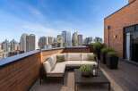 Experience breathtaking city views from this stunning rooftop terrace, perfect for entertaining or relaxing.
