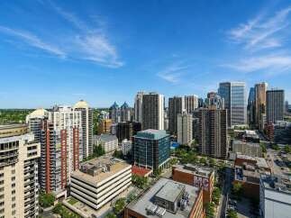 Experience urban living at its finest with this stunning cityscape view, showcasing a vibrant collection of modern high-rise buildings.