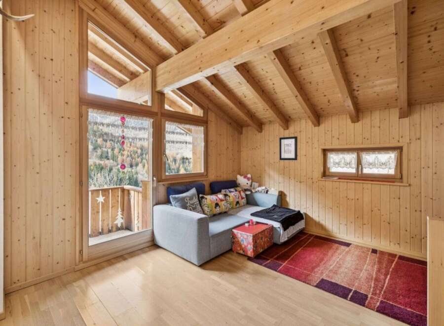 Experience cozy mountain living in this charming wooden cabin living room.