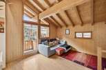 Experience cozy mountain living in this charming wooden cabin living room.