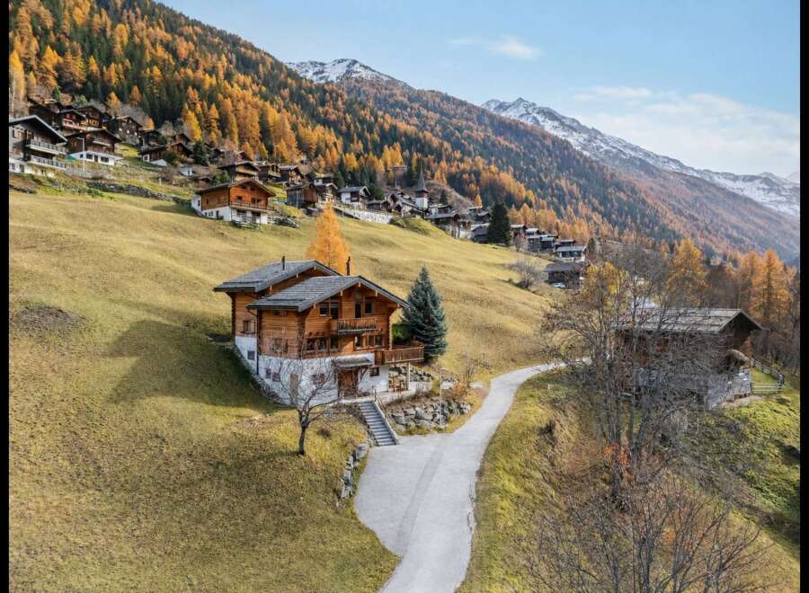 Experience alpine living in this charming wooden chalet nestled on a picturesque mountainside.