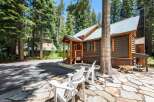 Experience rustic charm in this cozy cabin nestled amongst tall pine trees.