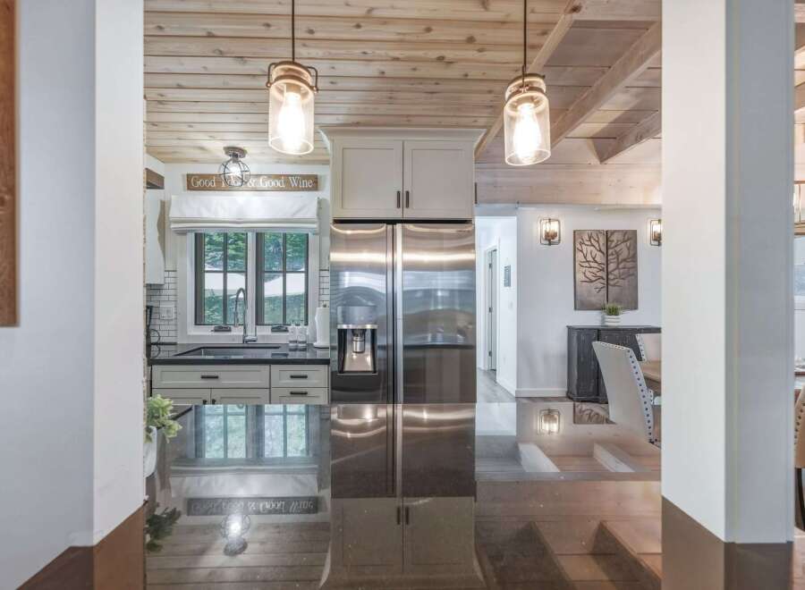 Experience the perfect blend of rustic charm and modern convenience in this stunning kitchen and dining area.