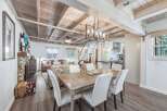 Experience rustic charm and modern comfort in this inviting living and dining space.