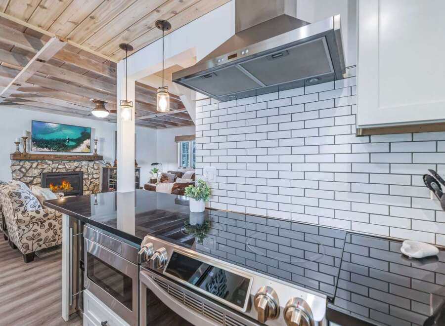 Experience the perfect blend of rustic charm and modern convenience in this stunning kitchen and living area.