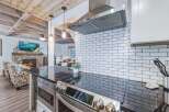Experience the perfect blend of rustic charm and modern convenience in this stunning kitchen and living area.