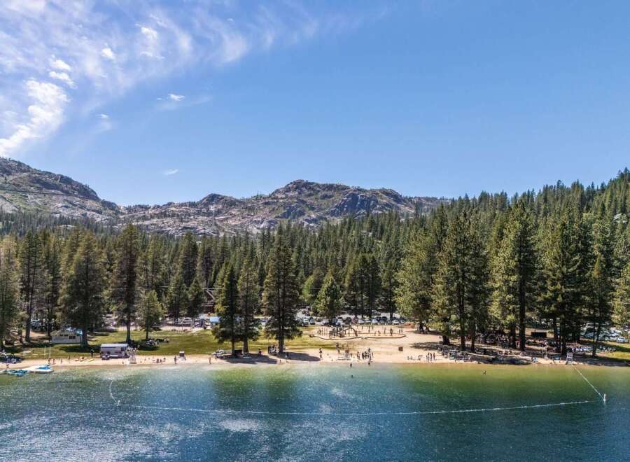 Experience the ultimate lakeside living with this stunning property offering direct access to a pristine beach and crystal-clear waters.