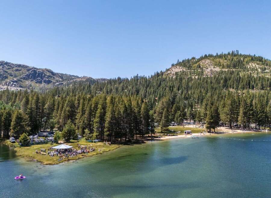Experience the ultimate lakeside living with this stunning property offering direct access to crystal-clear waters and a private beach area.
