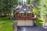 Nestled amidst towering trees, this charming mountain home offers a serene retreat.
