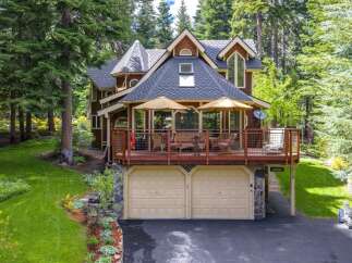 Nestled amidst towering trees, this charming mountain home offers a serene retreat.