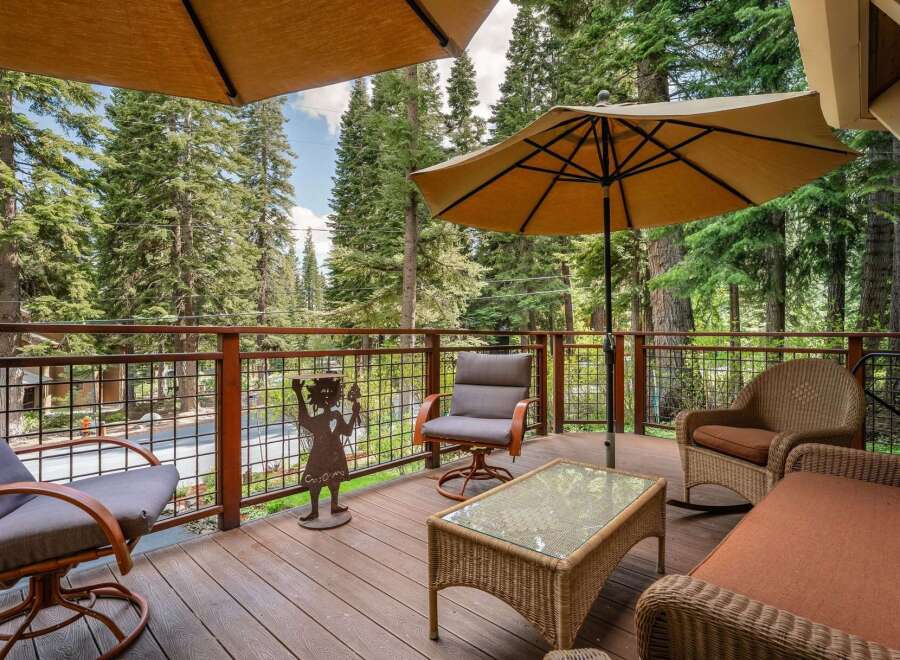 Enjoy the serene mountain setting from this spacious deck, perfect for outdoor living and entertaining.