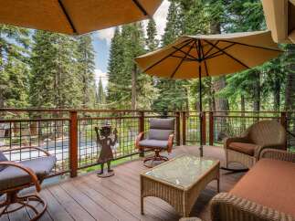 Enjoy the serene mountain setting from this spacious deck, perfect for outdoor living and entertaining.