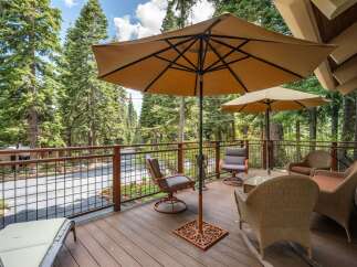 Enjoy the serene mountain views from this spacious deck, perfect for outdoor entertaining or quiet relaxation.