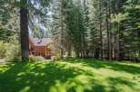 Nestled amidst a serene forest, this charming wooden home offers a tranquil retreat.