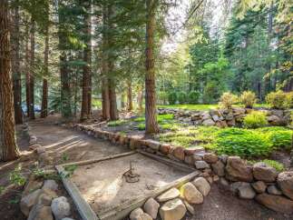 Enjoy outdoor recreation with a dedicated horseshoe pit nestled amongst mature pine trees.