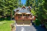 Nestled amidst towering pine trees, this stunning mountain home offers a perfect blend of rustic charm and modern comfort.