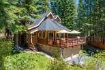 Nestled amidst towering pine trees, this charming wooden home offers a serene mountain retreat.