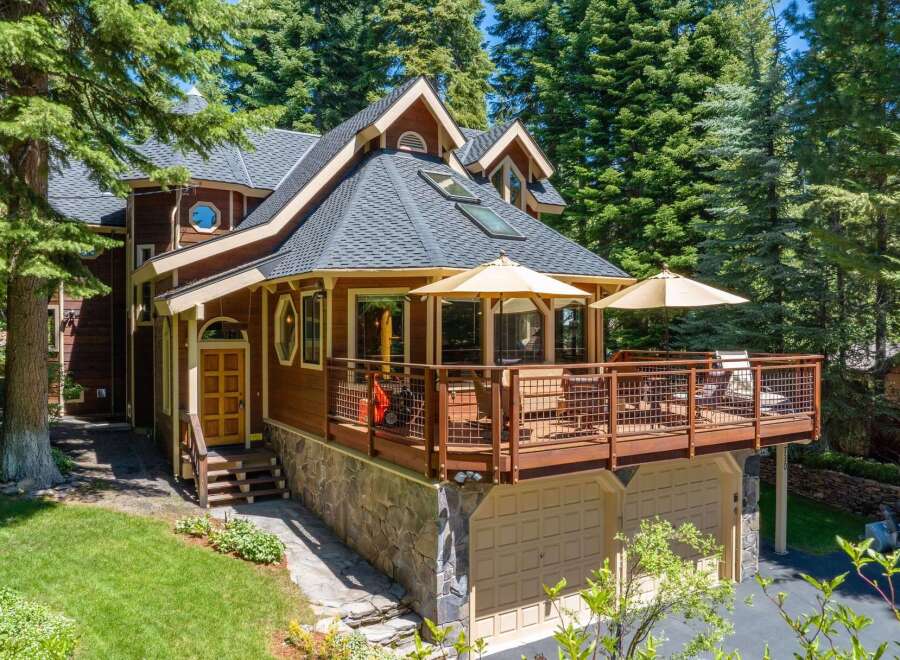 Nestled amidst towering pine trees, this charming mountain home offers a serene retreat.